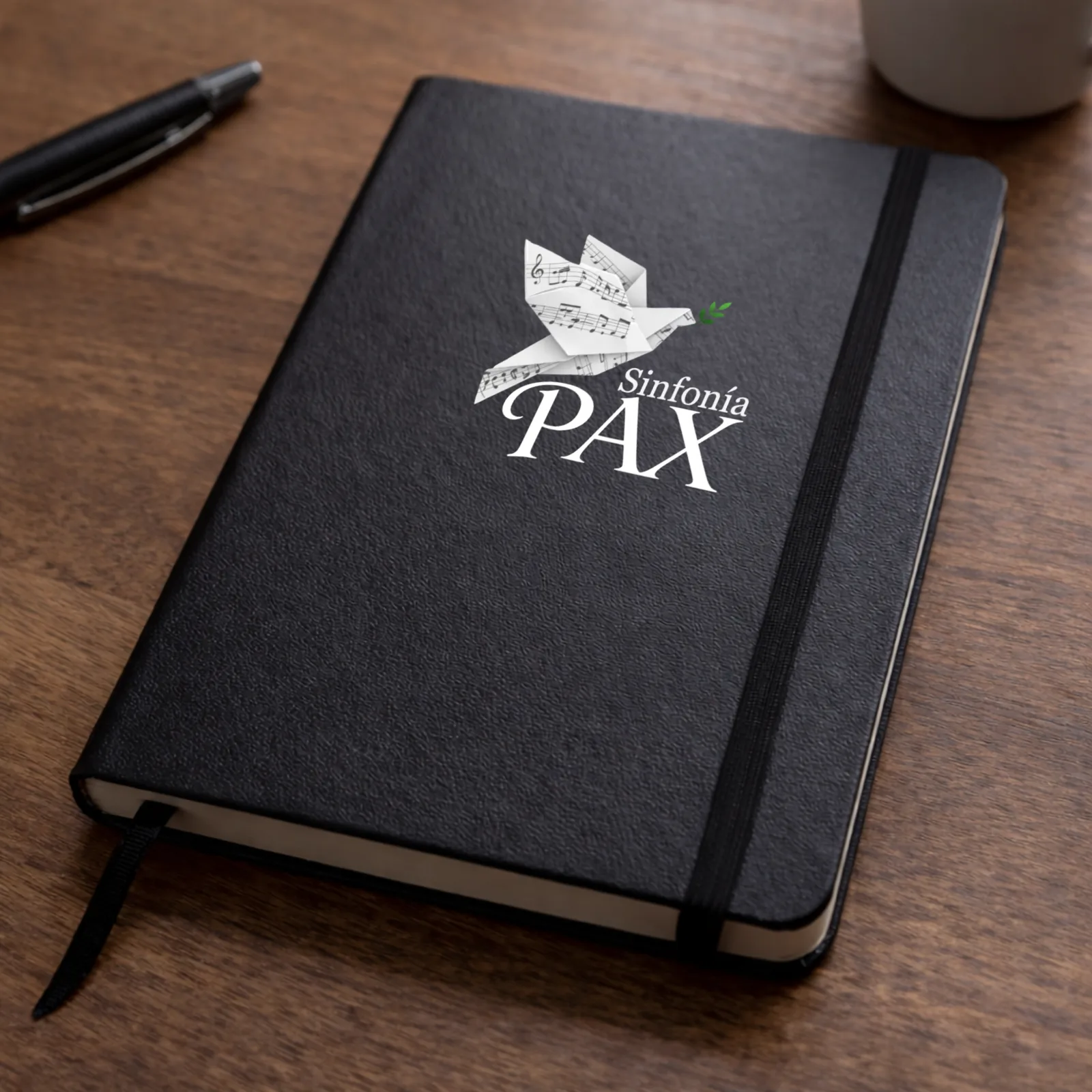 Libreta negra con la identidad de Sinfonía PAX